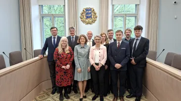 In the group photo, members of the delegations of the highest courts of Estonia and Germany stand in the plenary hall of the Supreme Court.